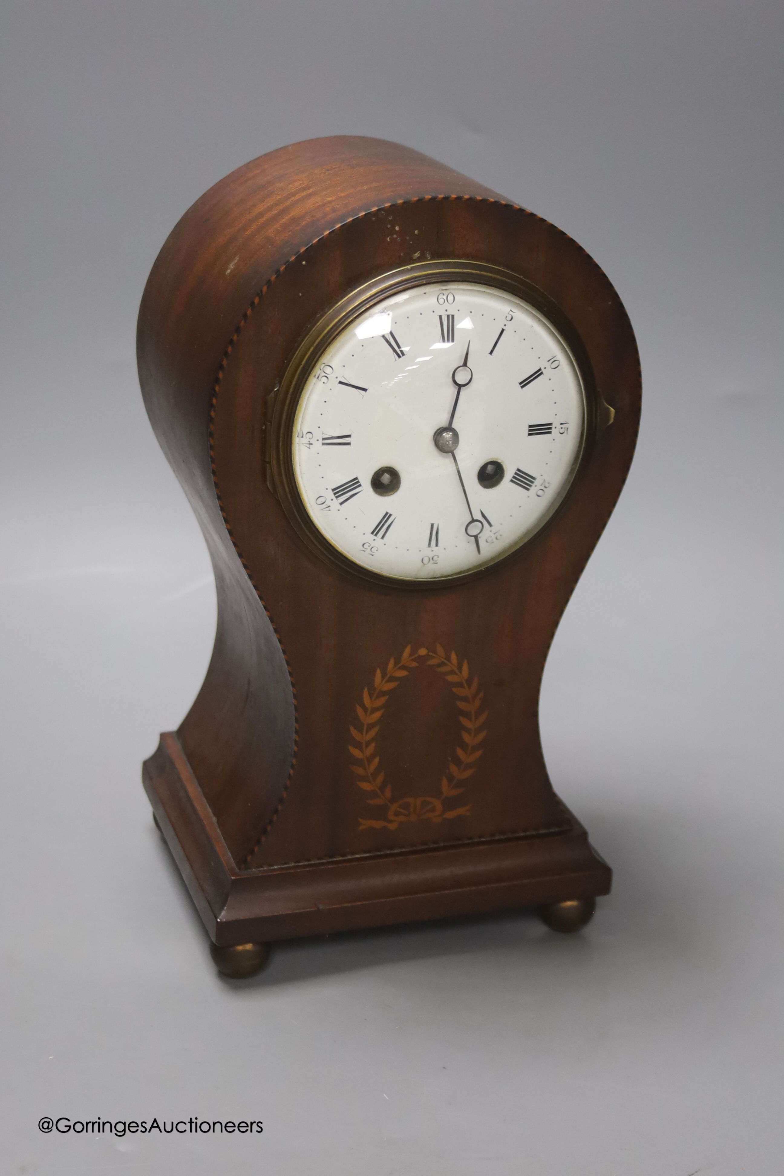 An Edwardian inlaid mantel clock, height 29cm, French drum movement